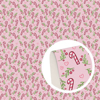 Christmas Candy Canes on Pink Faux Leather Sheet
