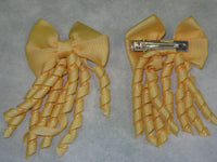 Plain Coloured Bow with curly ribbon
