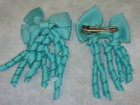 Plain Coloured Bow with curly ribbon
