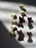 Clearance #54- Brown and White Leather Bows x 7
