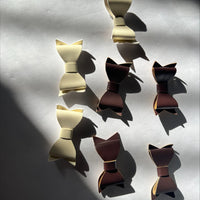 Clearance #54- Brown and White Leather Bows x 7